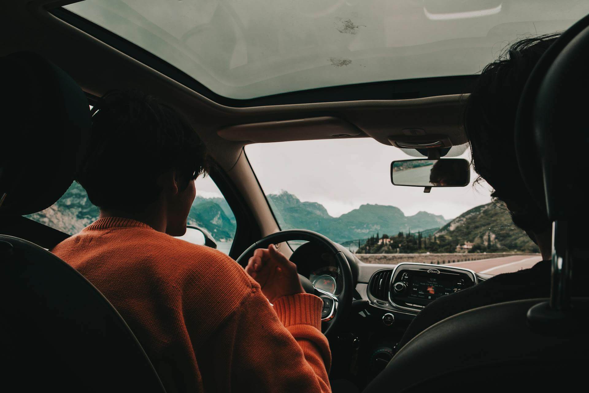 A student driving the car with the instructor