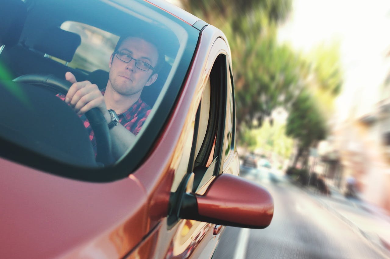 A man drivng a car